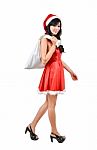 Santa Woman  Holding A White Bag Stock Photo