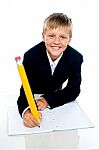 School Boy Writing Stock Photo