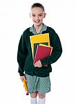 School Girl Standing With Notebooks Stock Photo