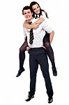 Schoolboy Carrying Piggyback Ride Stock Photo