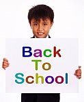 Schoolboy With Back To School Board Stock Photo