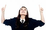 Schoolgirl Showing Pointing Upwards Stock Photo