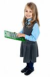 Schoolkid Pressing Key 5 On Big Green Calculator Stock Photo