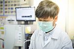 Scientist With Equipment And Science Experiments In White Tone Stock Photo