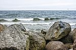 Sea Waves Break Down On A Large Stone Stock Photo