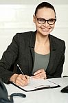 Secretary Writing Key Business Notes On Clipboard Stock Photo