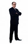 Senior Businessman Arm Crossed Stock Photo