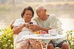 Senior Couple Using The Mobile Phone Stock Photo