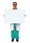 Senior Doctor Holding Blank Board Stock Photo