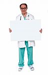 Senior Doctor Showing Blank Board Stock Photo