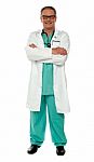 Senior Doctor With Arms Crossed Stock Photo