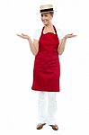 Senior Female Chef Showing Gesture Stock Photo