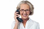 Senior Lady Attending Phone Call Stock Photo