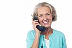 Senior Lady Holding Phone Receiver Stock Photo