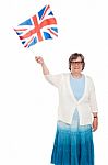 Senior Lady Holding UK Flag Stock Photo