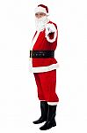 Senior Man In Santa Costume Pointing At You Stock Photo