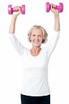 Senior Woman Exercising With Dumbbells Stock Photo