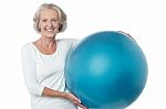 Senior Woman Posing With Exercise Ball Stock Photo