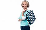 Senior Woman Posing With Shopping Bag Stock Photo