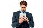 Serious Corporate Working On Tablet Pc Stock Photo