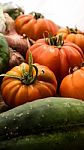 Several Vegetables On Wooden Chopping Board And Table Stock Photo