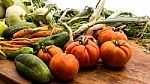 Several Vegetables On Wooden Chopping Board And Table Stock Photo