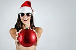 Sexy Santa Girl In Bikini Holding A Christmas Ball Stock Photo