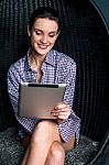 Sexy Woman Browsing On Touch Pad Device Stock Photo