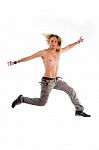 Shirtless Male Jumping In Joy Stock Photo