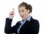 Shocking Corporate Woman Pointing Upwards Stock Photo