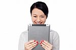 Shy Pretty Corporate Lady Holding Tablet Device Stock Photo