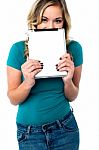 Shy Pretty Model Hiding Face With Tablet Pc Stock Photo