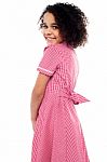 Shy School Girl In Pink Uniform Stock Photo