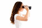 Side Pose Of Female Holding Binocular Stock Photo