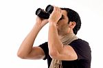 Side Pose Of Man Looking Through Binocular Stock Photo