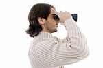 Side Pose Of Young Man Watching Through Binocular Stock Photo