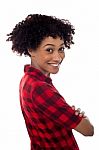 Side Profile Of Slim Young Smiling Woman, Arms Crossed Stock Photo