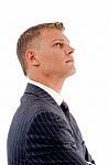 Side View Of Businessman Looking Up Stock Photo