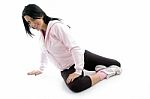 Side View Of Female Doing Exercise On White Background Stock Photo