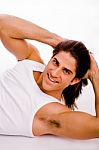 Side View Of Smiling Exercising Male Stock Photo