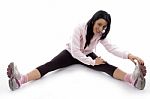 Side View Of Smiling Woman Stretching Her Legs On White Background Stock Photo