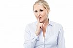 Silence Gesture By Young Corporate Lady Stock Photo