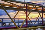 Silhouette Of Structure Of The Bridge In Sun Set At The Sea Stock Photo