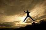 Silhouette Tourist Man Open Arm. He Is Happy In The Mountain. To Stock Photo