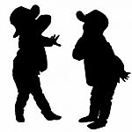 Silhouettes Of Two Little Boys Stock Photo