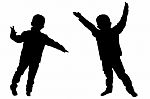 Silhouettes Of Two Little Boys Stock Photo