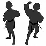 Silhouettes Of Two Little Boys Stock Photo