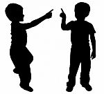 Silhouettes Of Two Little Boys Stock Photo