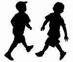 Silhouettes Of Two Little Boys Stock Photo