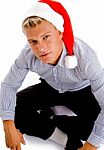 Sitting Male With Christmas Hat Stock Photo